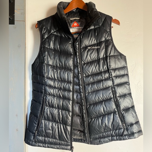 Black Columbia puffer vest with sheen. Insulated and warm. Omni heat technology. - Picture 1 of 4